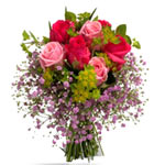 A sweet combination of red and pink roses with sma...