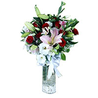 Pink Lilies and Roses in a vase. In this bouquet i...