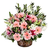 In this basket our florist beautifully arranged ge...