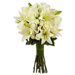 An angelic combination of white lilies and white a...