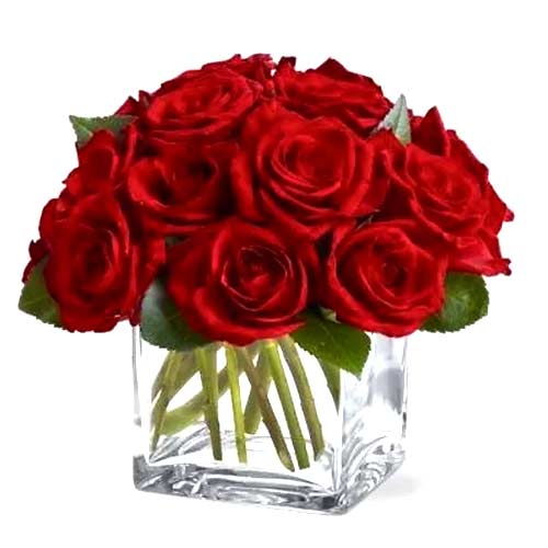 A dozen lush red roses arranged into an unadorned ......  to Dubai
