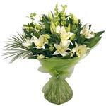 A calming white bouquet of lilies for any occasion......  to Kawr Fakkan