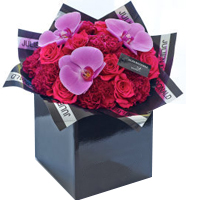 Charming Composition of Carnations, Orchids N Roses<br><br>