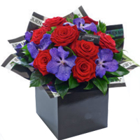 Breathtaking Gift Box of 8 Red Roses N 5 Purple Orchids