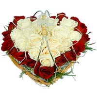 Arrangement of red and white roses in heart shape...