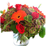 This lovely bunch is made of bright gerberas nestl...