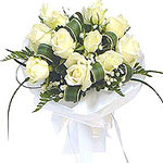 Elegance in its simplicity,  This snow-shine bouquet of white roses is accented ...