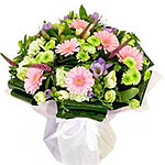 This Chic bloom bouquet is made of pink gerberas with white, green and purple bl...