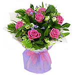 A soft and Delicate bouquet  of pink roses gives a touch of romance.. This beaut...