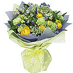 This bouquet is composed of seasonal flower like ranunkulus, Camilla with greene...