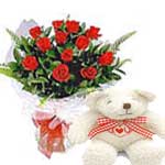 Teddy bear and red roses