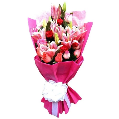 Celebrate in style with this Classic Bouquet of Fresh Pink Flowers, Green Foliag...