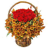 This golden daisy and red rose basket arrangement is matched with well on every ...
