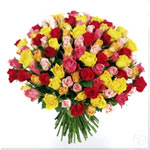 99 stem assorted color roses handtied in round shape, gathered with green grasse...